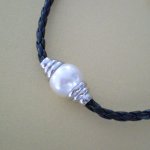 Pearl Braided Cord Necklace
An elegant contemporary design necklace featuring a single cream pearl on a black braided necklaceFor a casual smart look dress it with a white shirt and jeans  Or fo.
Please Click the image for more information.